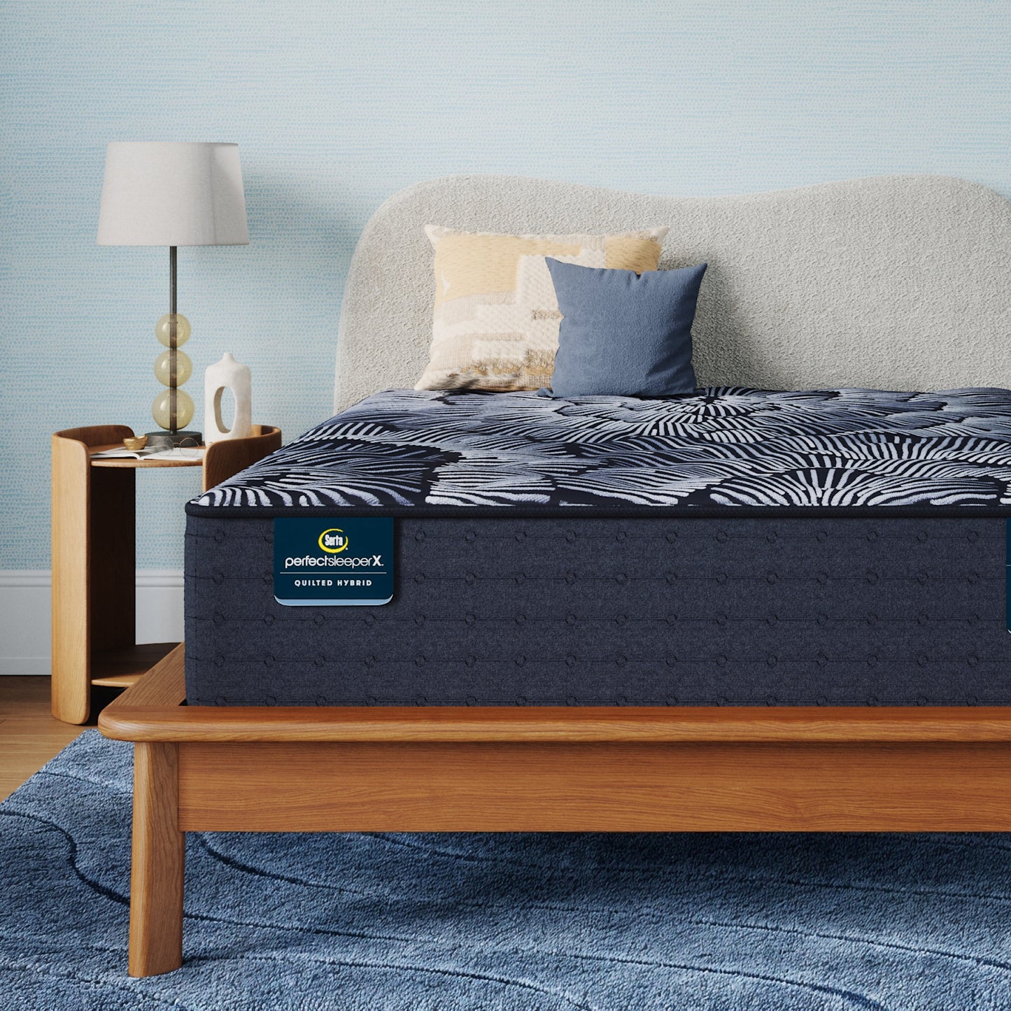 Perfect Sleeper X Quilted Hybrid Knox Plush Mattress sitting in a brown bedframe || feel: Plush || level: Level 1