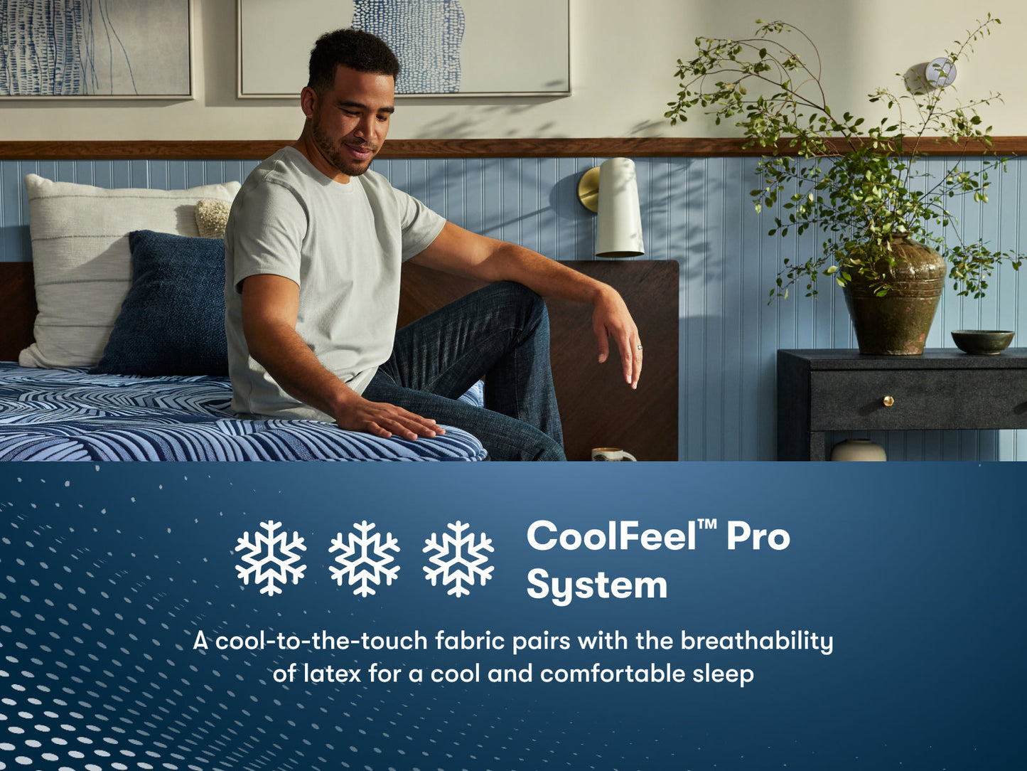Man sitting on the right side of a Perfect Sleeper Pro Kensington Medium Mattress feeling the cool to the touch top of the mattress || Level: Level 1 || Feel: Medium