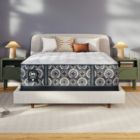 Serta perfect sleeper plush mattress on a bed in a bedroom setting with a Serta logo.