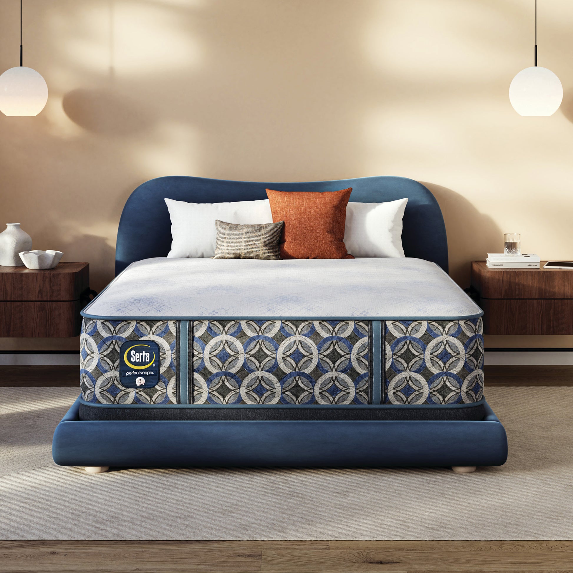Serta pefect sleeper hybrid plush mattress with decorative pillows on a bed in a bedroom setting
