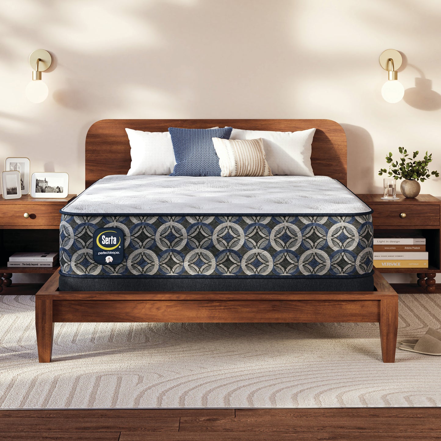 Serta Perfect Sleeper medium mattress on a wooden bed frame with pillows in a bedroom setting