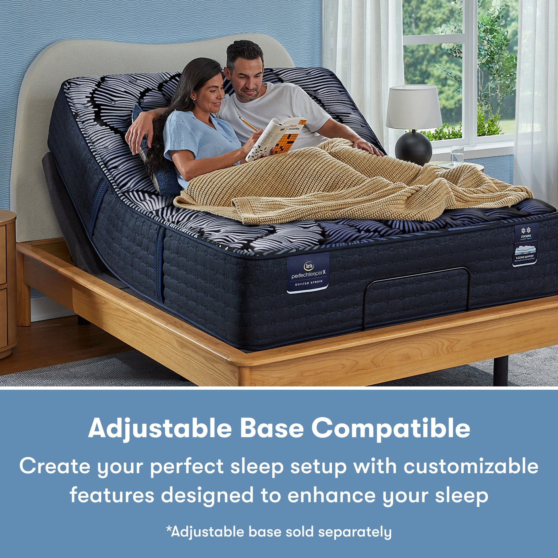 Man and woman sitting in a Perfect Sleeper X Quilted Hybrid Max Firm Pillow Top Mattress sitting in an adjustable base frame || feel: Firm Pillow Top || level: Level 2