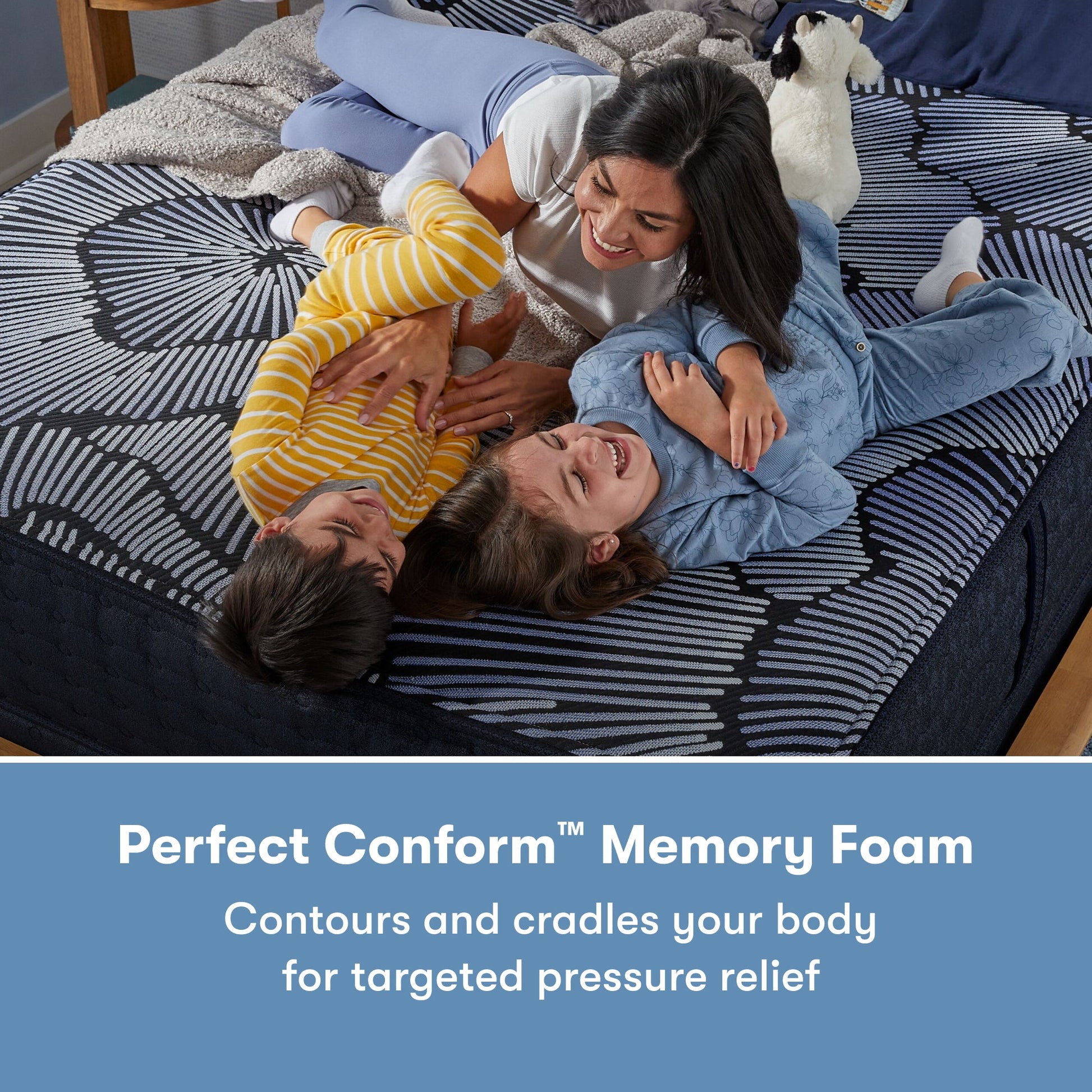 Family of 3 laying on a Perfect Sleeper X Hybrid Kendall Medium Mattress || feel: medium || level: Level 1