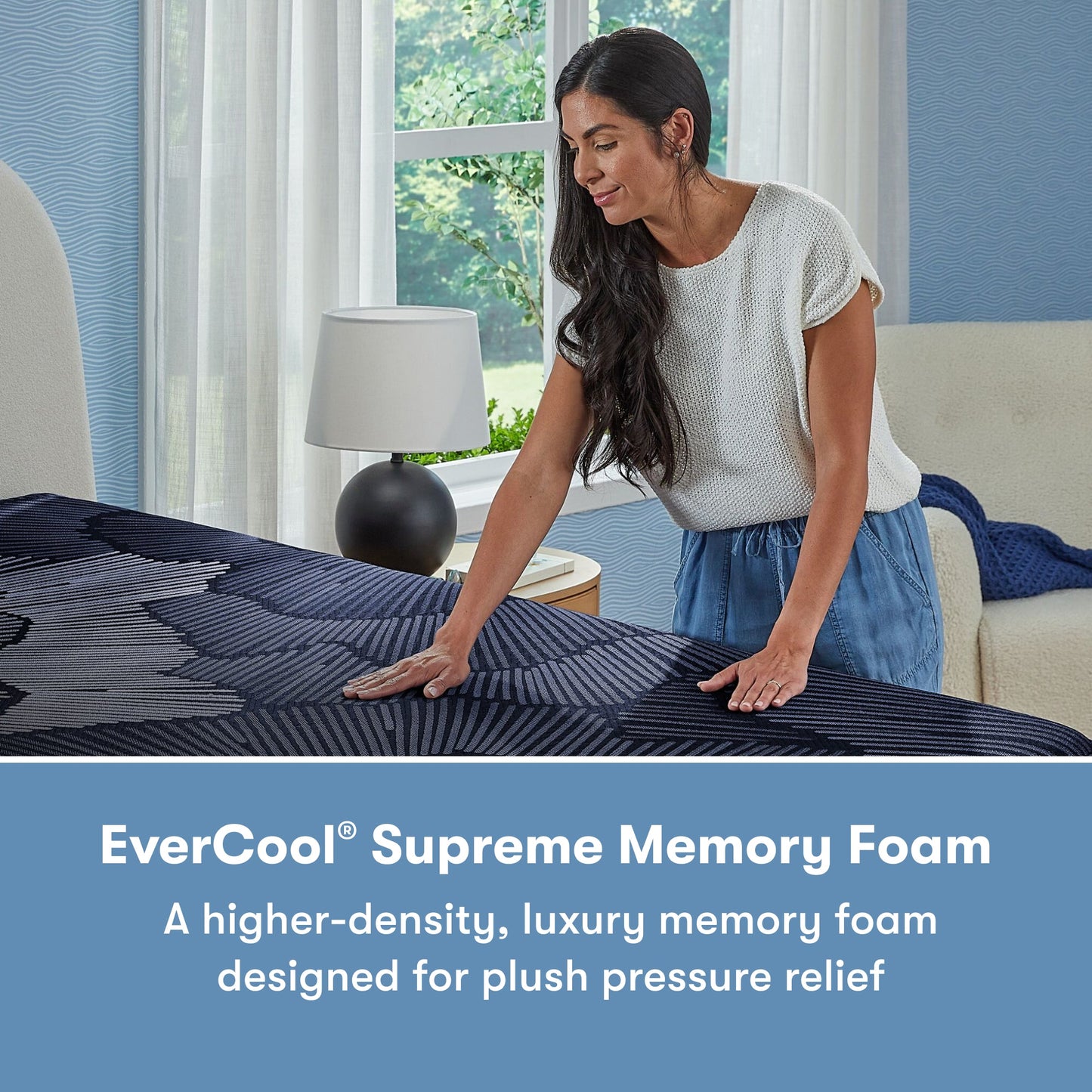 Woman standing on the right side of a Perfect Sleeper X Hybrid Prescot Plush Mattress rubbing on the mattress || feel: Plush || level: Level 2