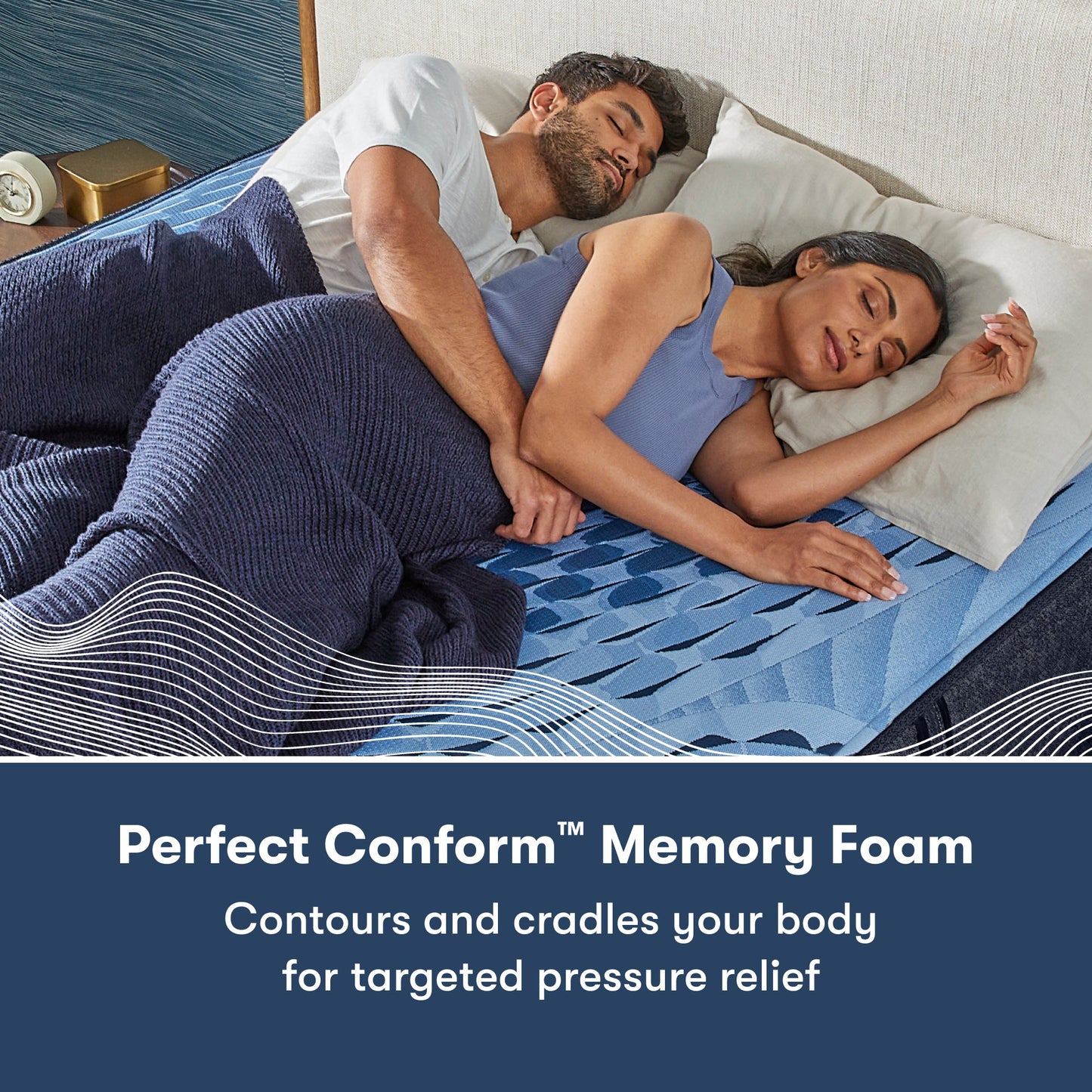 Man and woman laying on a Serta iComfort mattress on their right side || feel: plush || level: Enhanced - 14"