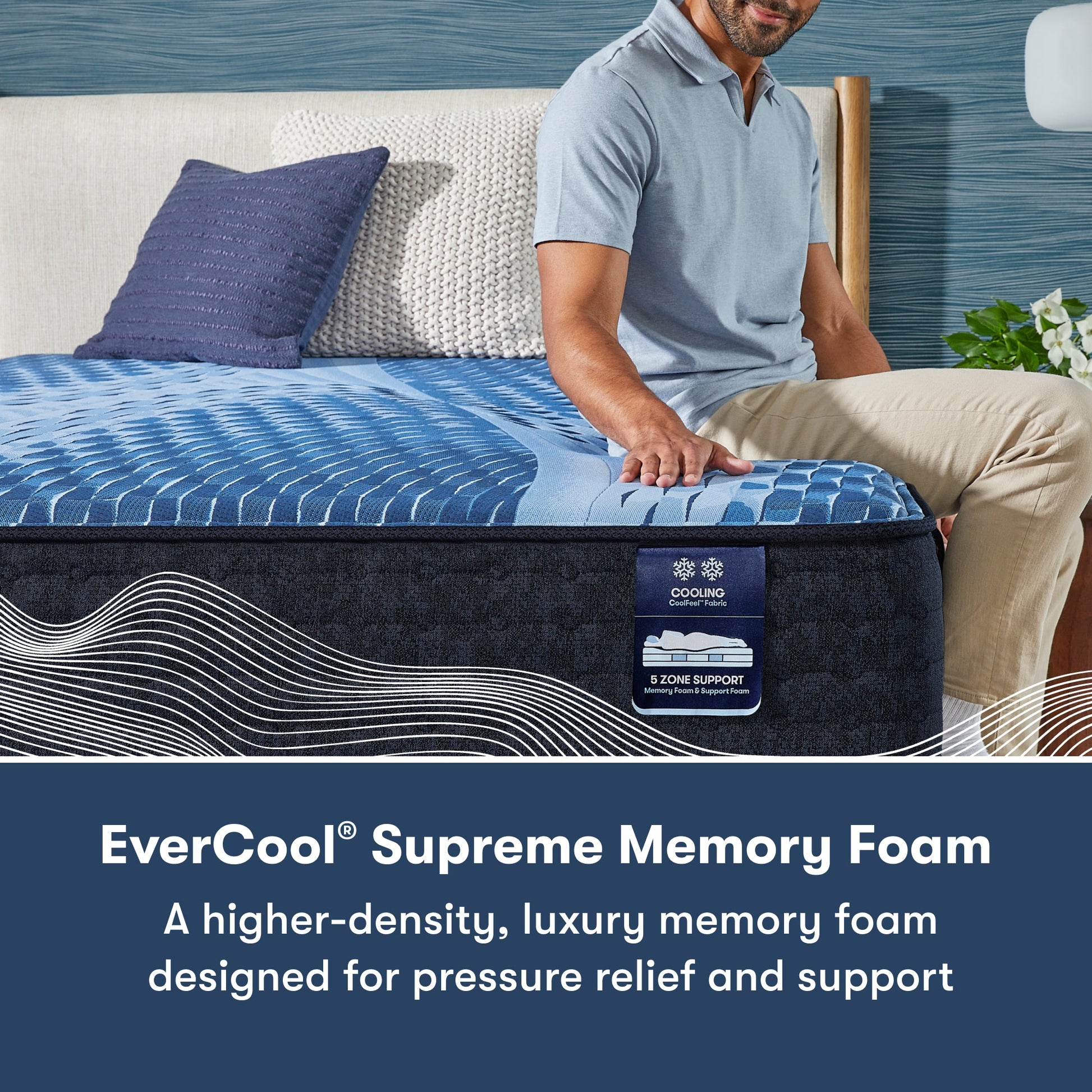 Man sitting on the right side of a Serta iComfort mattress || feel: plush || level: Enhanced - 14"