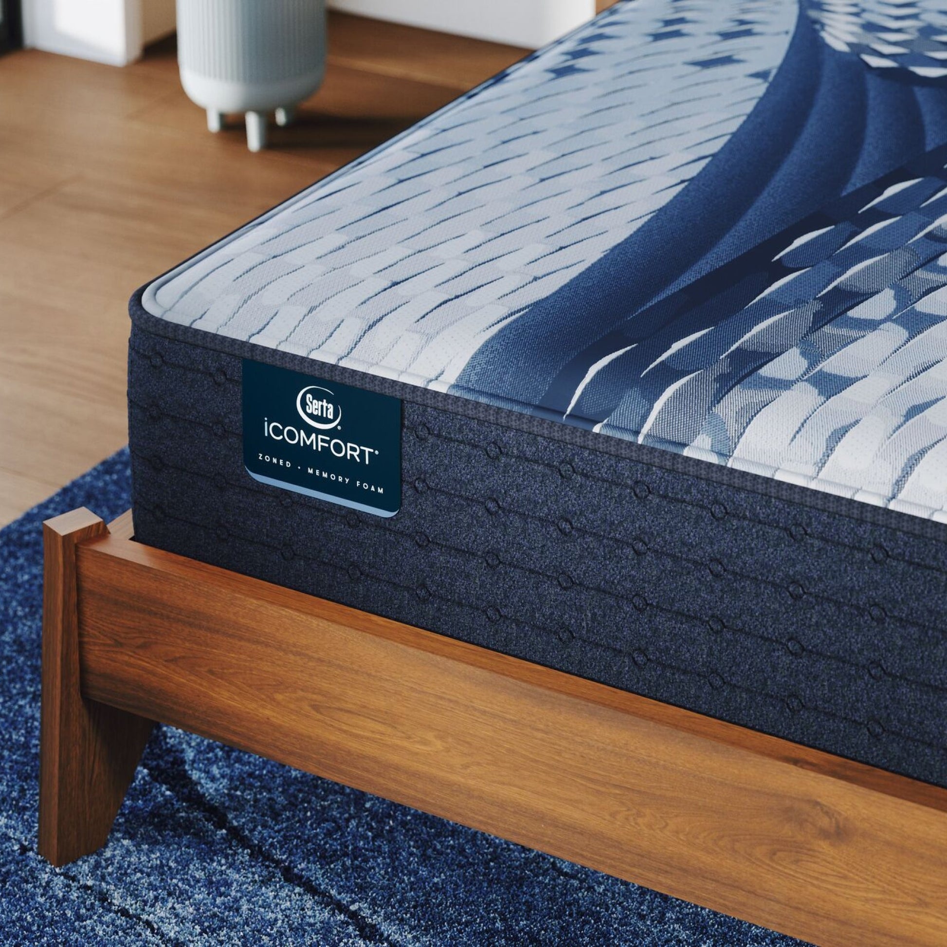 Corner of a iComfort Aveda Plush Mattress sitting in a brown bedframe || feel: plush || level: Standard - 12"