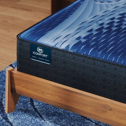 iComfort Aspire Plush Mattress sitting in a brown bedframe || feel: plush || level: Enhanced - 14"