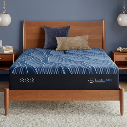 Bed frame with a blue Serta iSeries NXG mattress topper in a bedroom setting