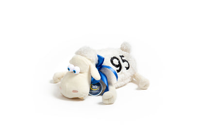 White Serta plush sheep toy with a blue collar and '95' tag on a white background