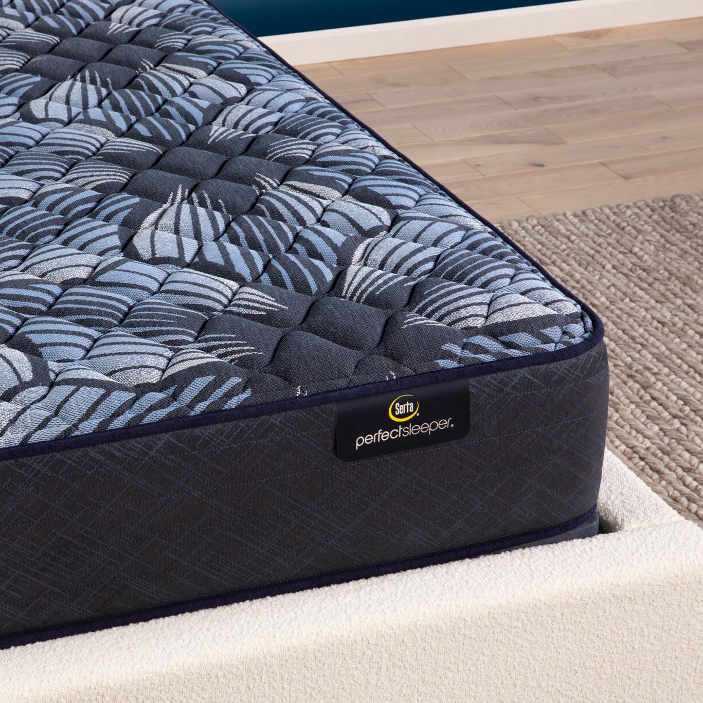 Corner view of the Serta Perfect Sleeper Sleep Excellence mattress in a bedroom | feel: Firm