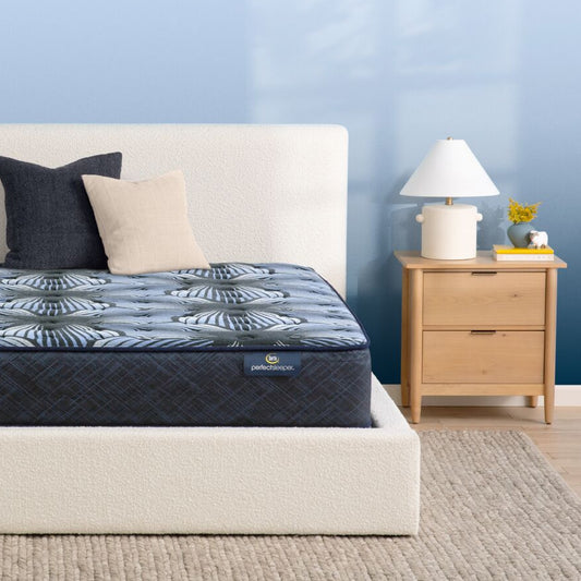 The Serta Perfect Sleeper Sleep Excellence mattress in a bedroom on a white bed | feel: Extra Firm