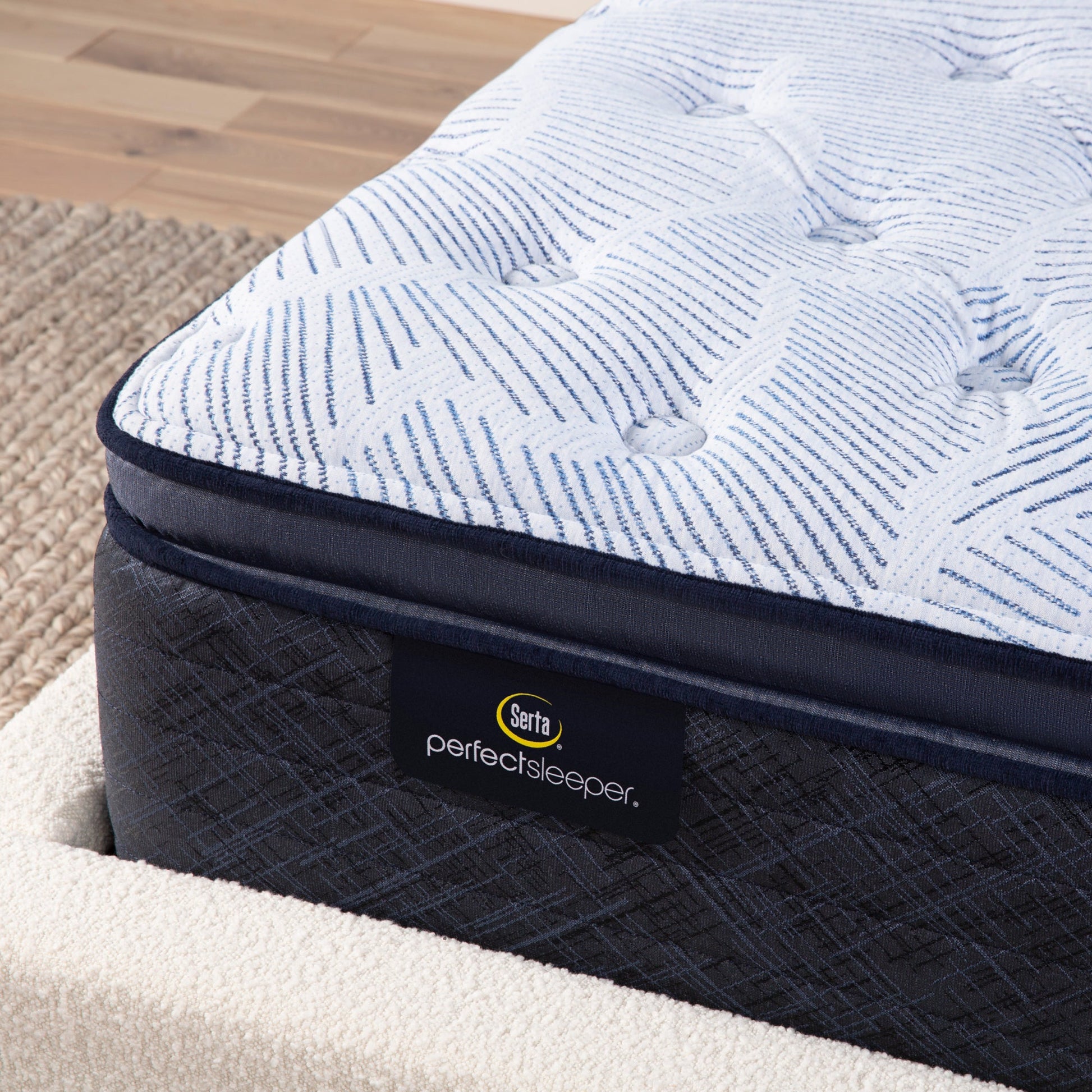 Corner detail of a Serta Perfect Sleeper plush pillow top mattress||feel: plush pillow top||level: enhanced